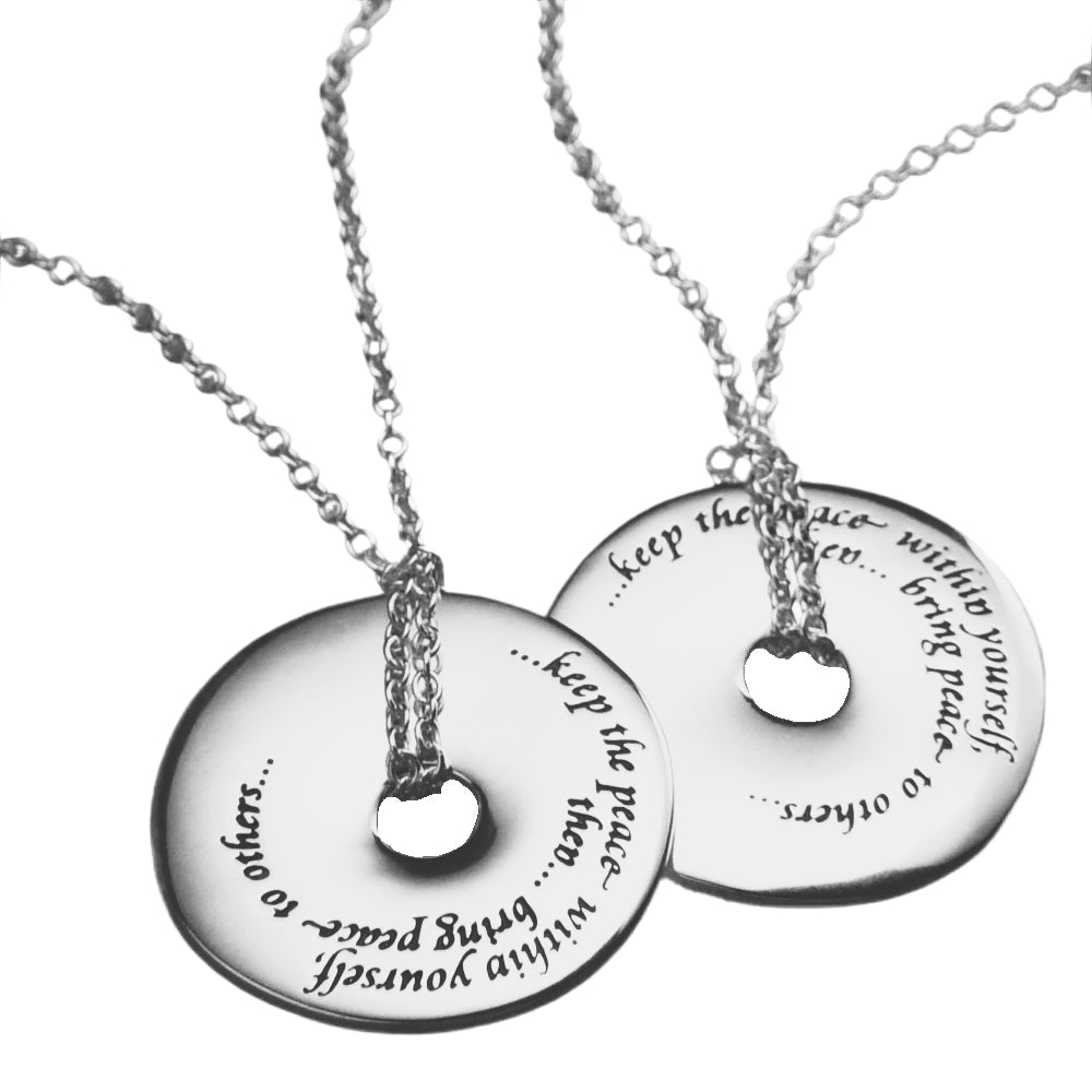 white gold disc pendant with quote inscribed