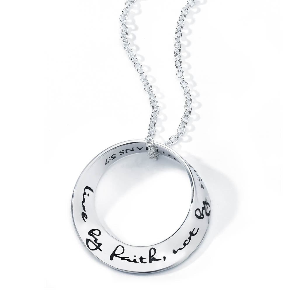 white gold round pendant with scripture inscribed