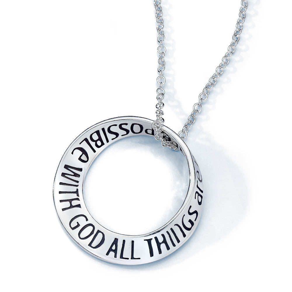 white gold round pendant with quote inscribed