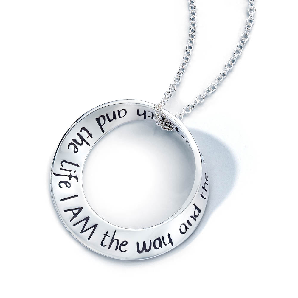 white gold round pendant with scripture inscribed