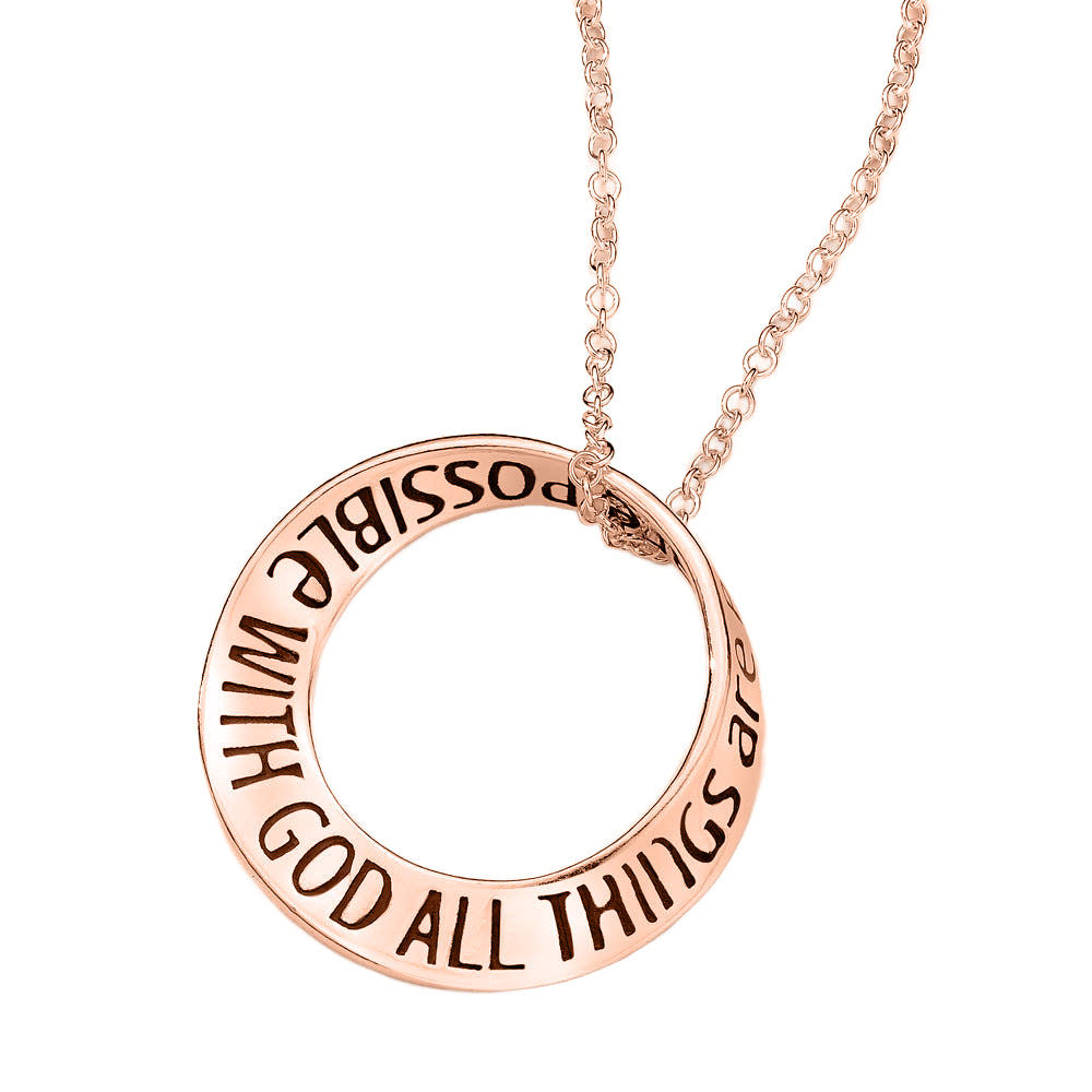 round gold round pendant with quote inscribed